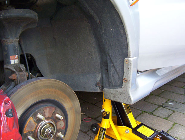 Image of the 4 wheel arch bolts removed