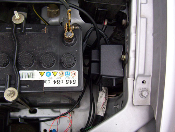 The engine bay showing roughly where the cables come out, and a good place to mount the black box.